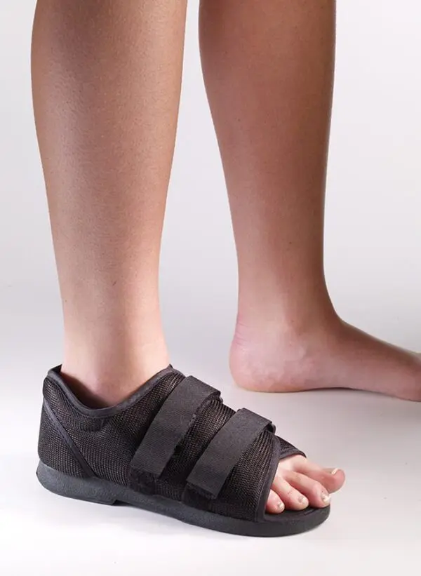 Foot with black orthopedic shoe