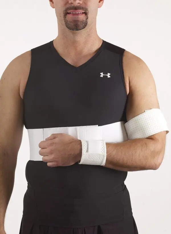 Man wearing arm sling and black tank top.