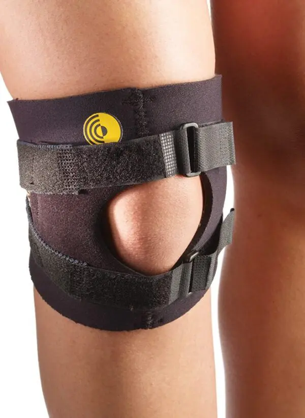 Leg wearing a black knee brace