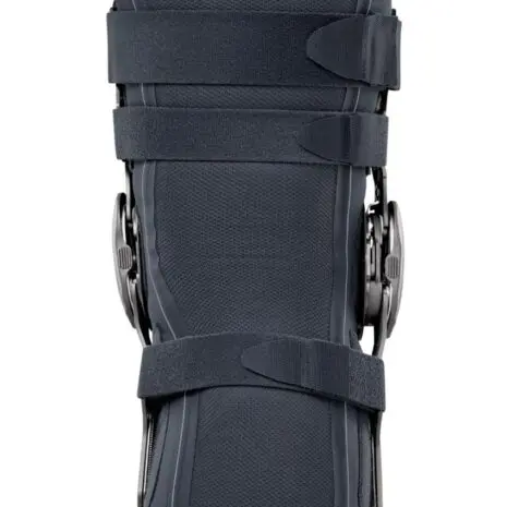 Black orthopedic knee brace with straps