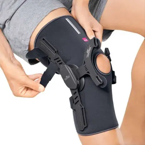 Knee support with adjustable straps in use.
