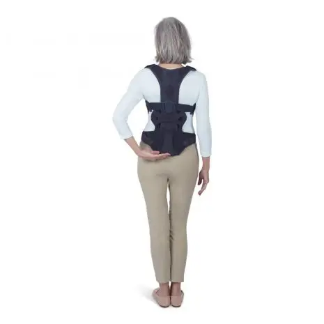 Woman demonstrating back support device