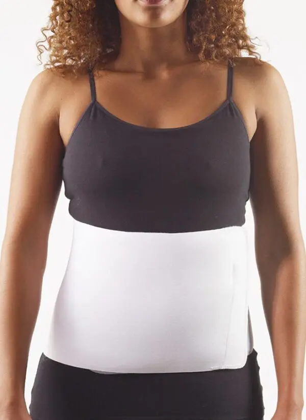 Woman wearing a white abdominal binder
