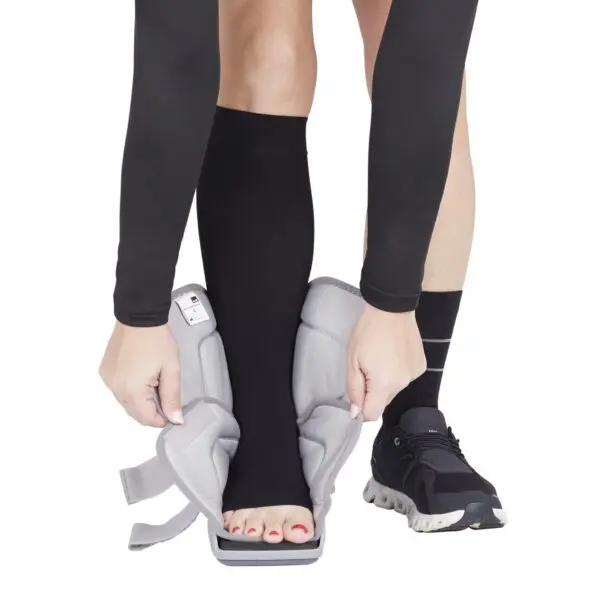 Person wearing a compression sock and brace